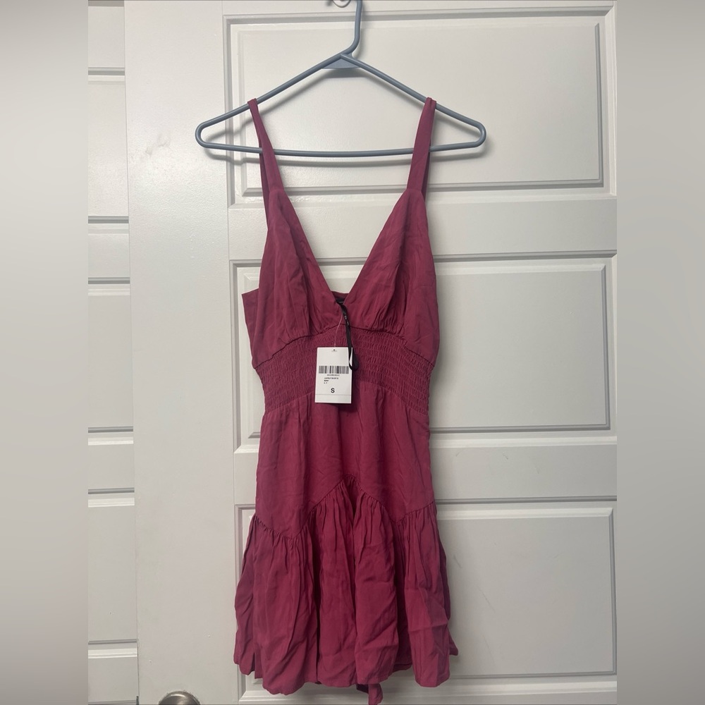 Fashion Nova pink romper.